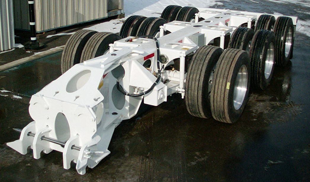 White color 18 wheel tridem booster for the wind energy industry